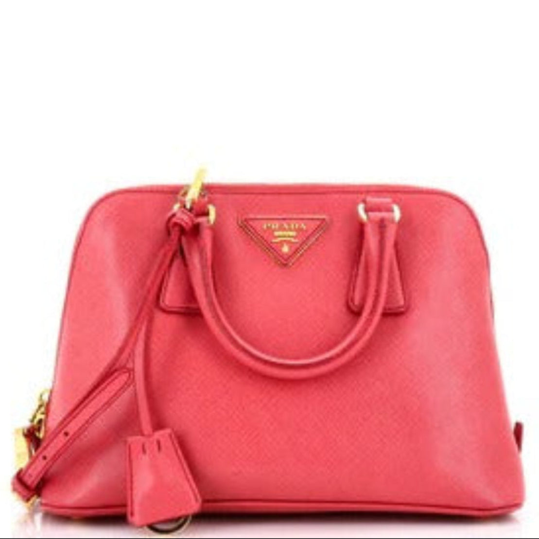 Red handbag with gold accents on a white background