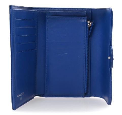 Blue wallet with visible brand logo on a white background