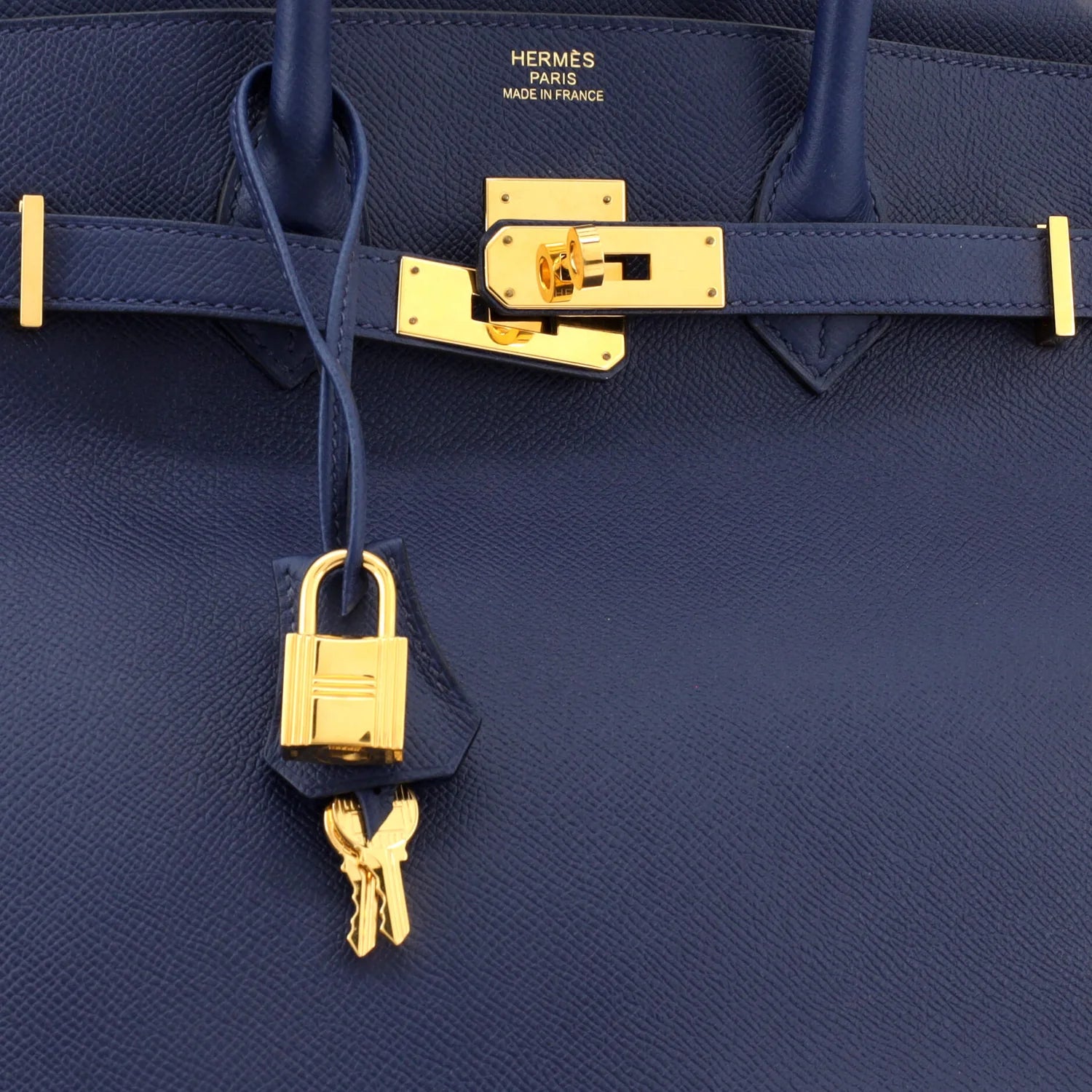 Navy blue Hermès Birkin bag with gold hardware and lock