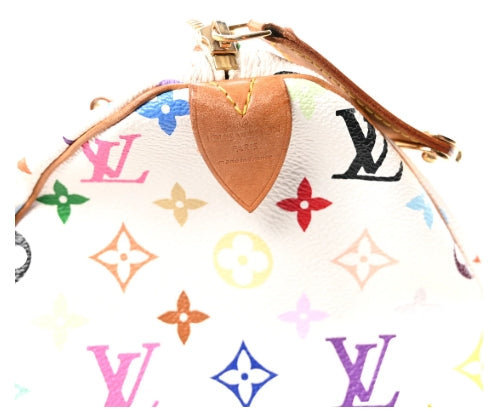 Louis Vuitton multicolor monogram pouch with a heart-shaped brown leather patch on a white background