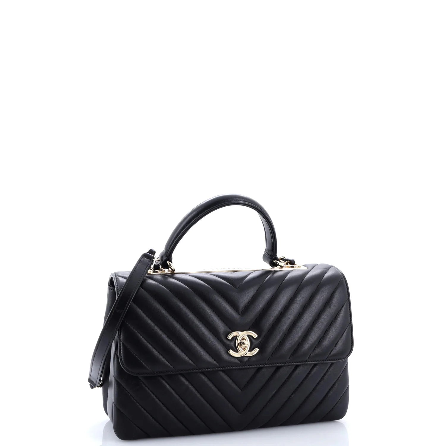Black quilted classic Chanel leather handbag with gold hardware on a white background