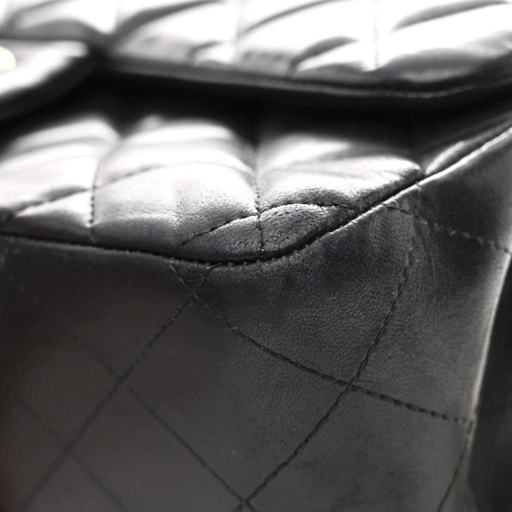 Close-up of a quilted black leather handbag chanel jumbo lambskin black 