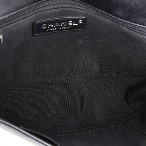 Close-up of a Chanel handbag interior with visible branding.