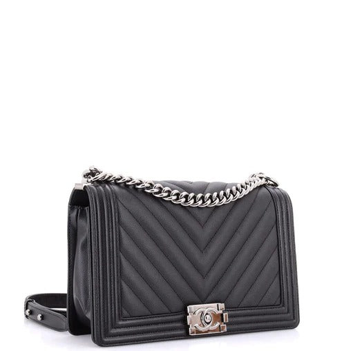 chanel boy bag caviar chevron  Black quilted handbag with a chain strap on a white background