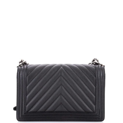 chanel boy bag caviar chevron  Black quilted handbag on a white background