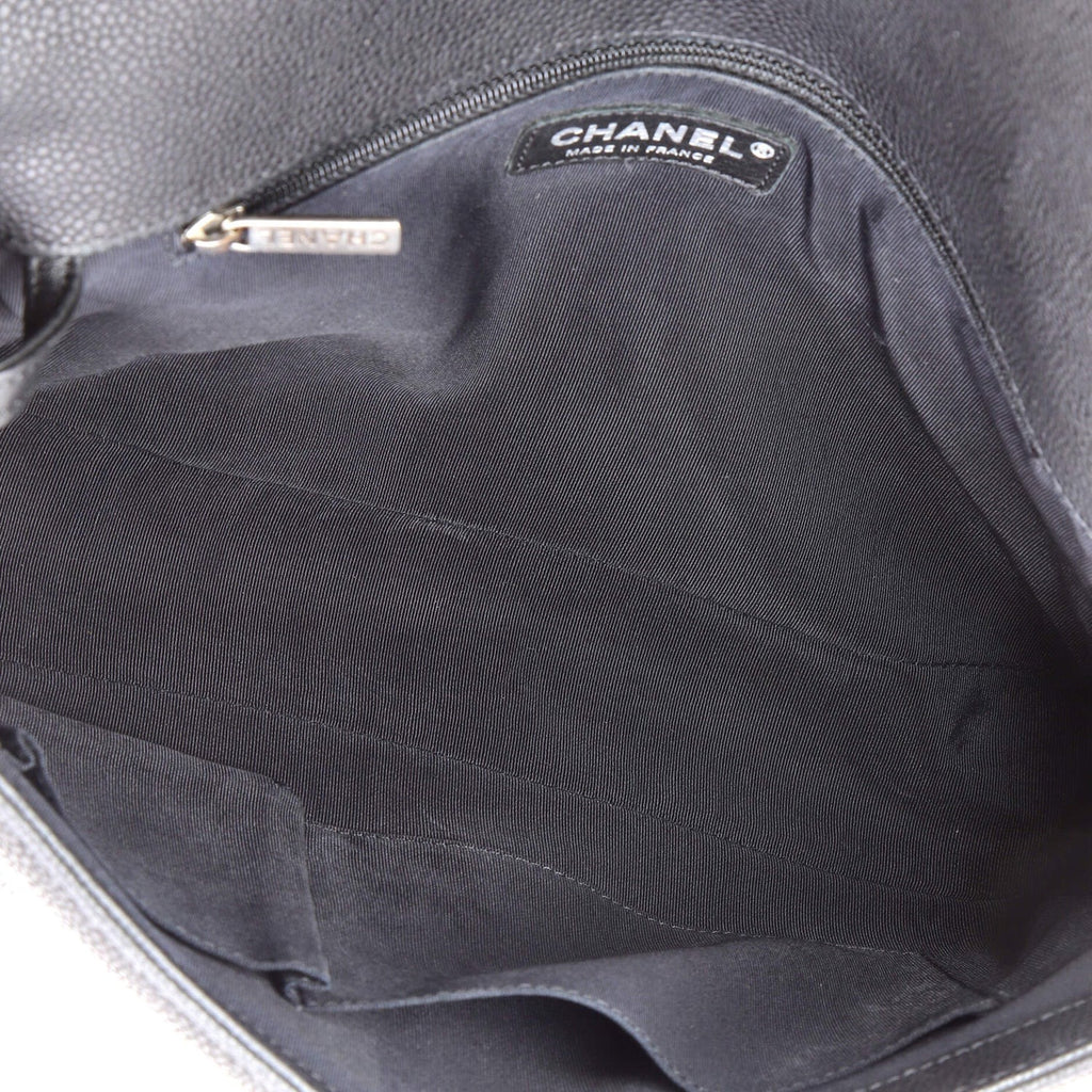 Close-up of a Chanel handbag with a visible logo on the interior.