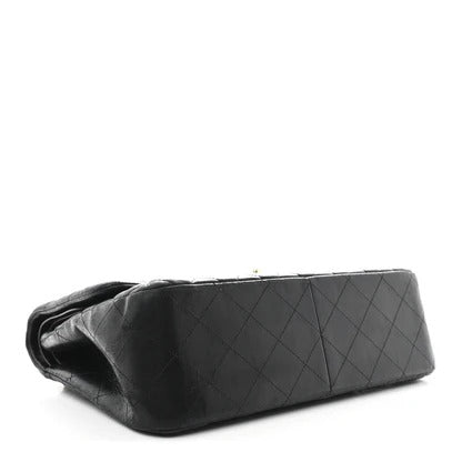 chanel jumbo lambskin Black quilted handbag on a white background