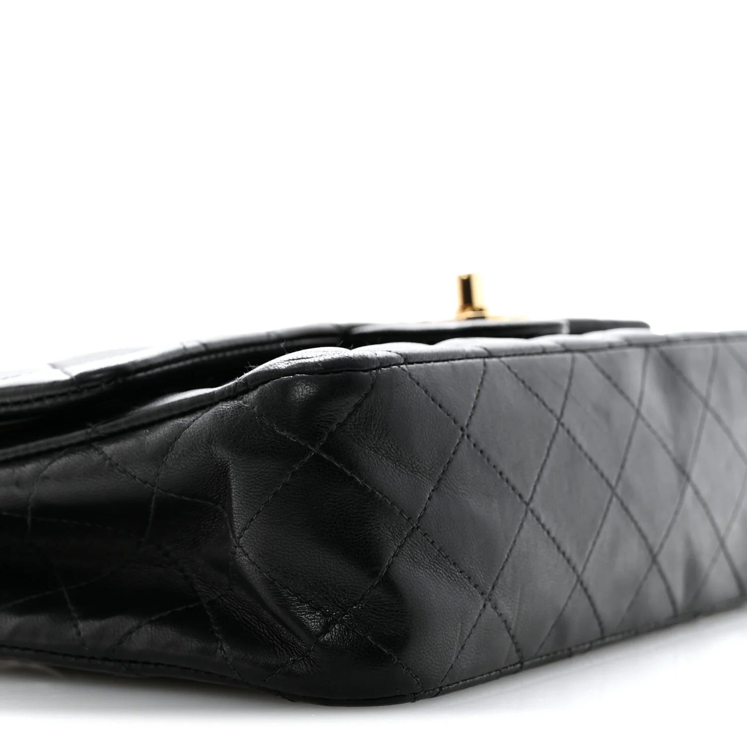 chanel lambskin medium double flap  Black quilted handbag on a white background