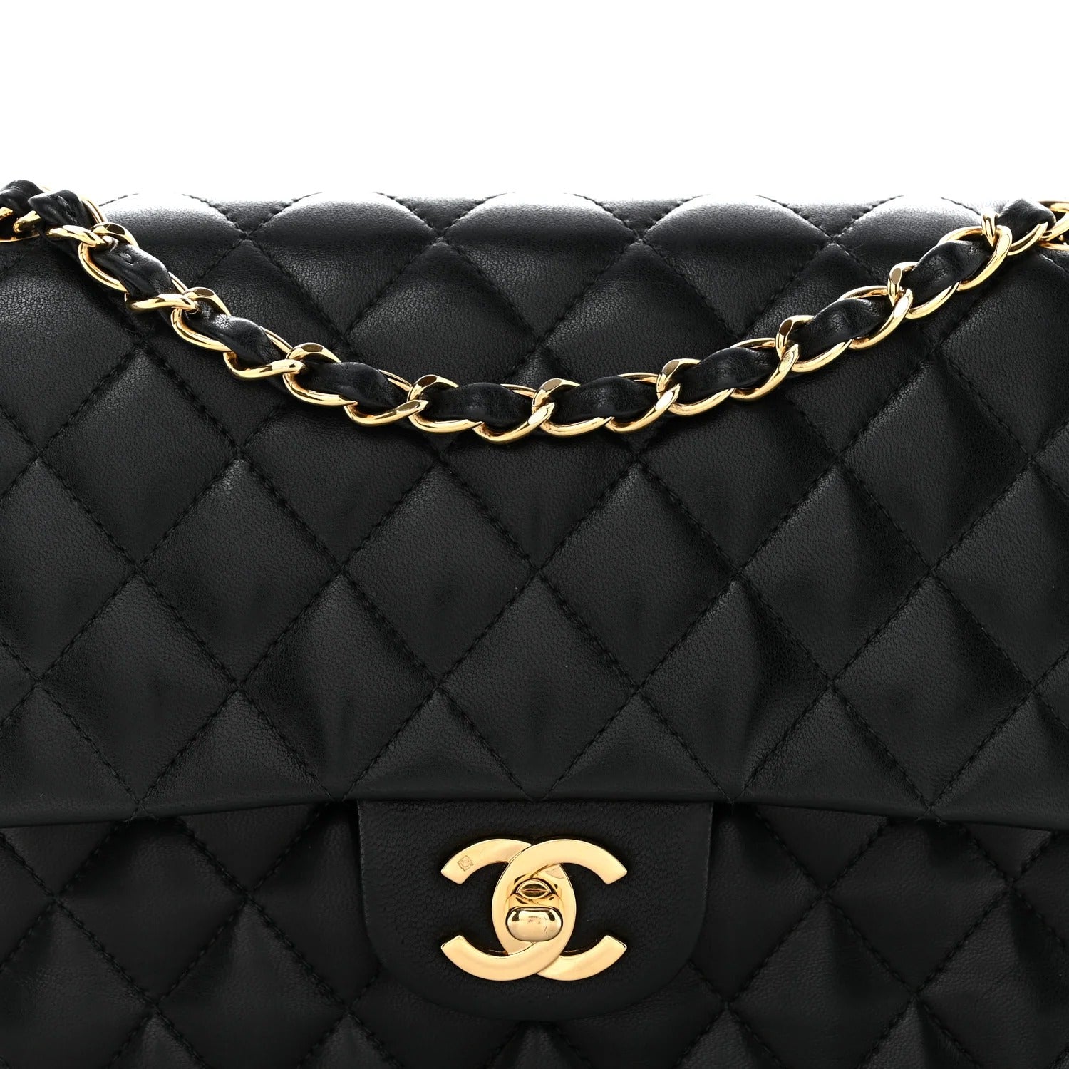 chanel lambskin medium double flap  Black quilted handbag with gold chain and logo on a white background