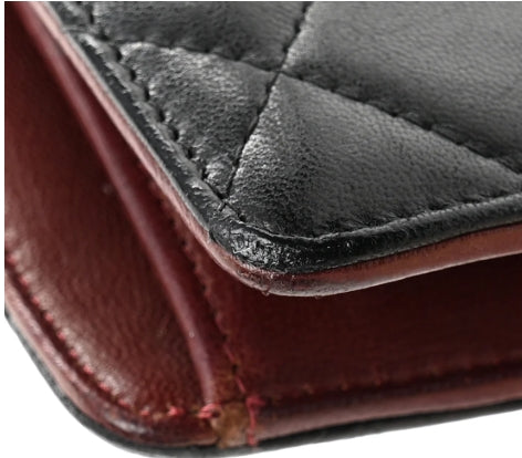Close-up of a leather chanel wallet with visible stitching and texture