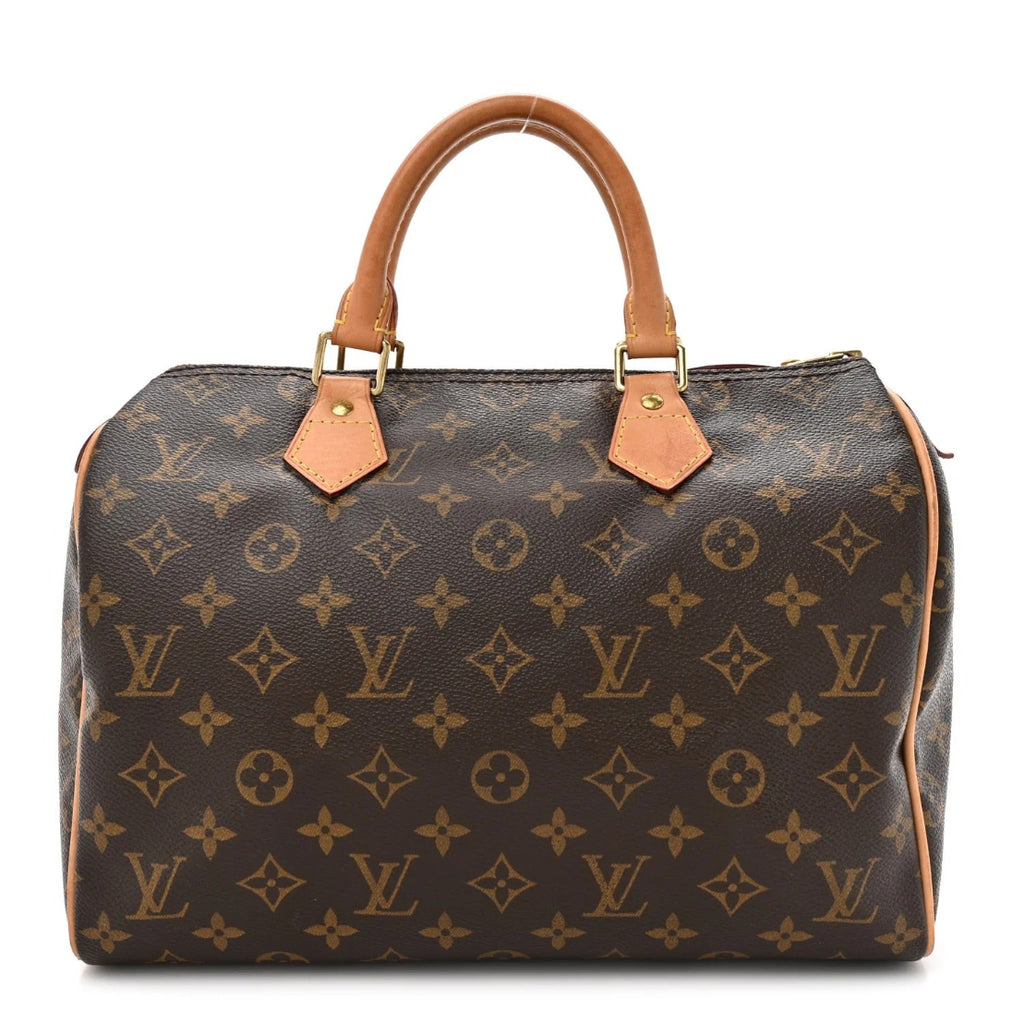 Designer handbag with monogram pattern on a white background