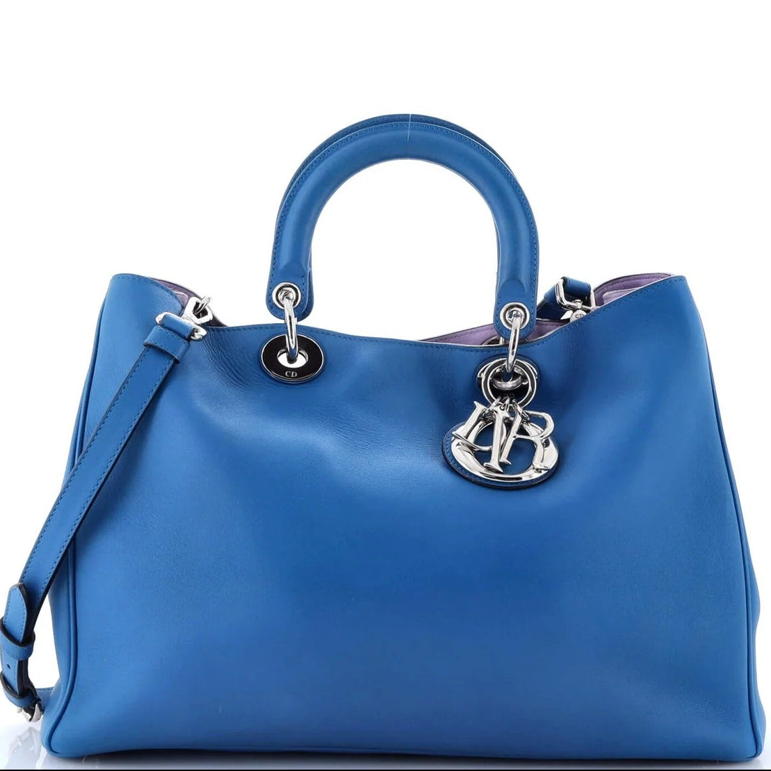christian dior diorissmo blue tote with a brand logo on a white background