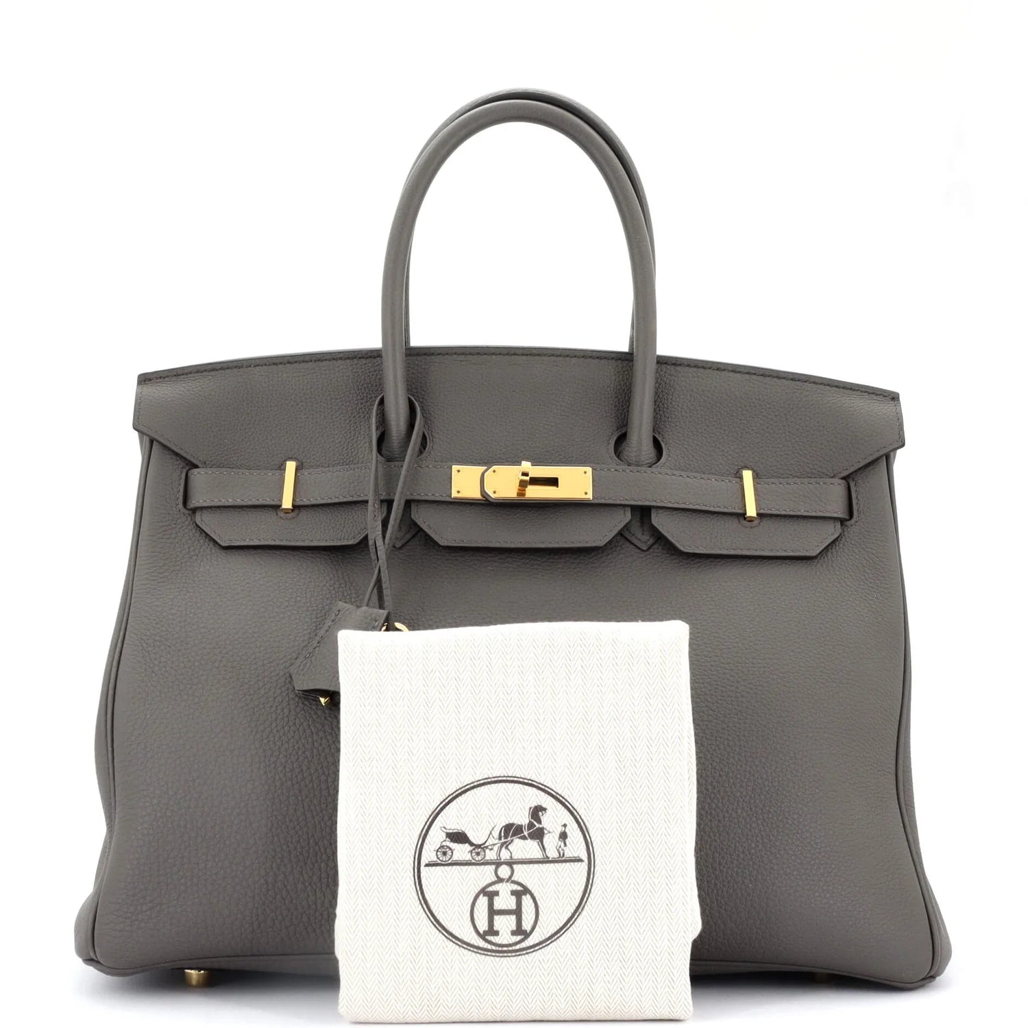 Gray Hermes Birkin handbag with gold hardware and a white cloth with a logo on a white background