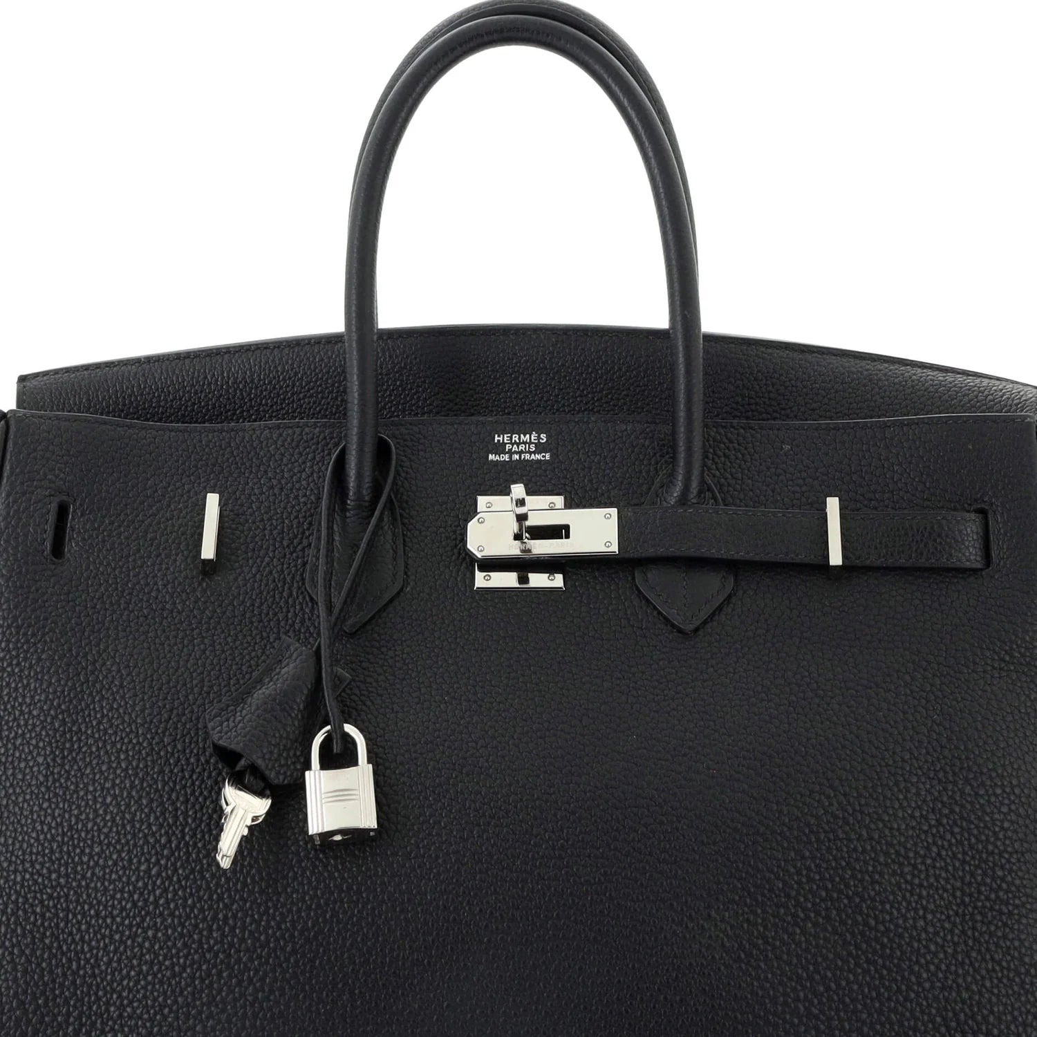 Black Hermès bag with silver hardware on a white background