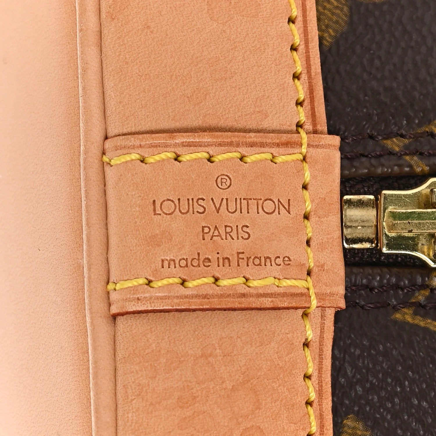 louis vuitton alma pm  leather strap with brand logo and text