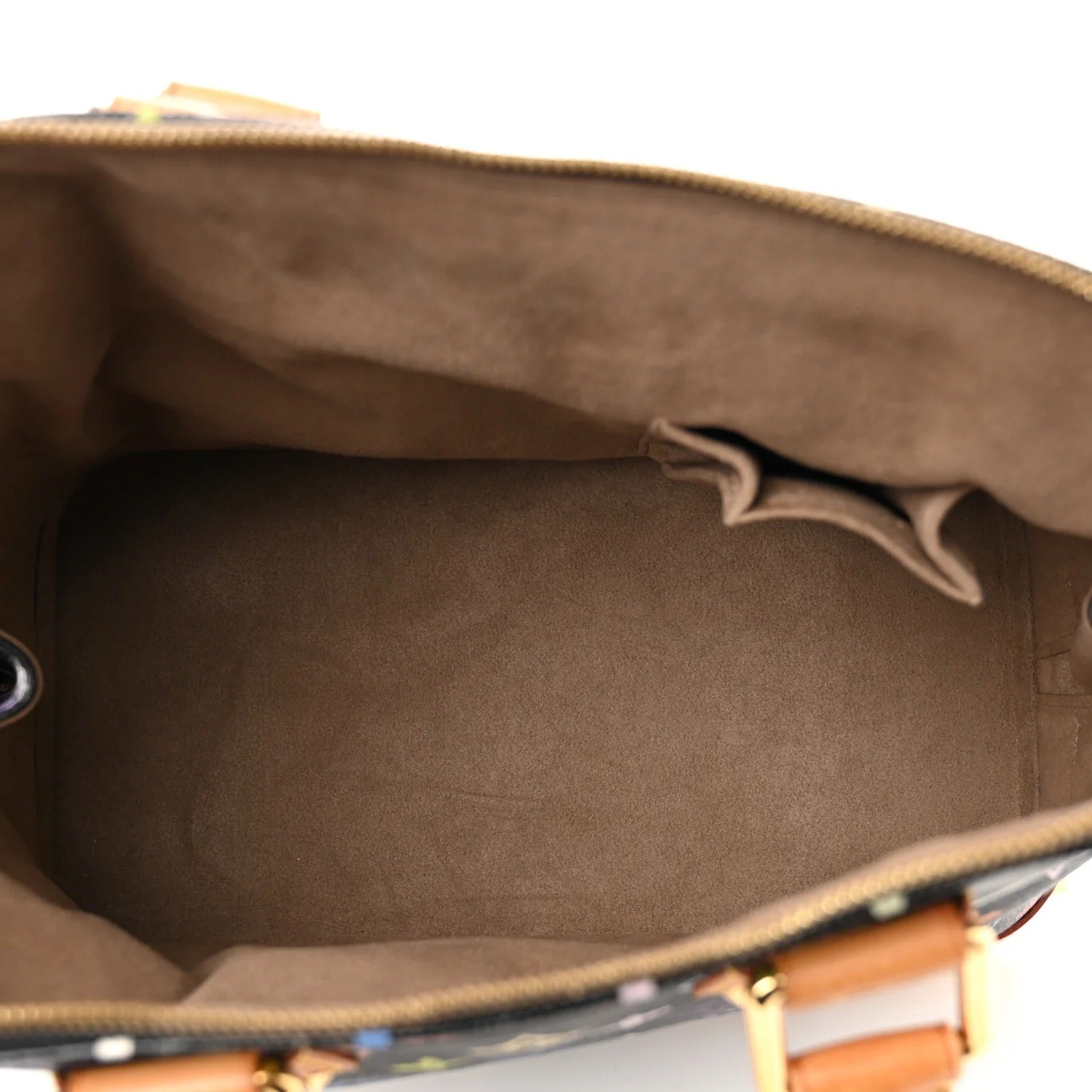 Close-up of a brown leather bag with visible louis vuitton murakami alma