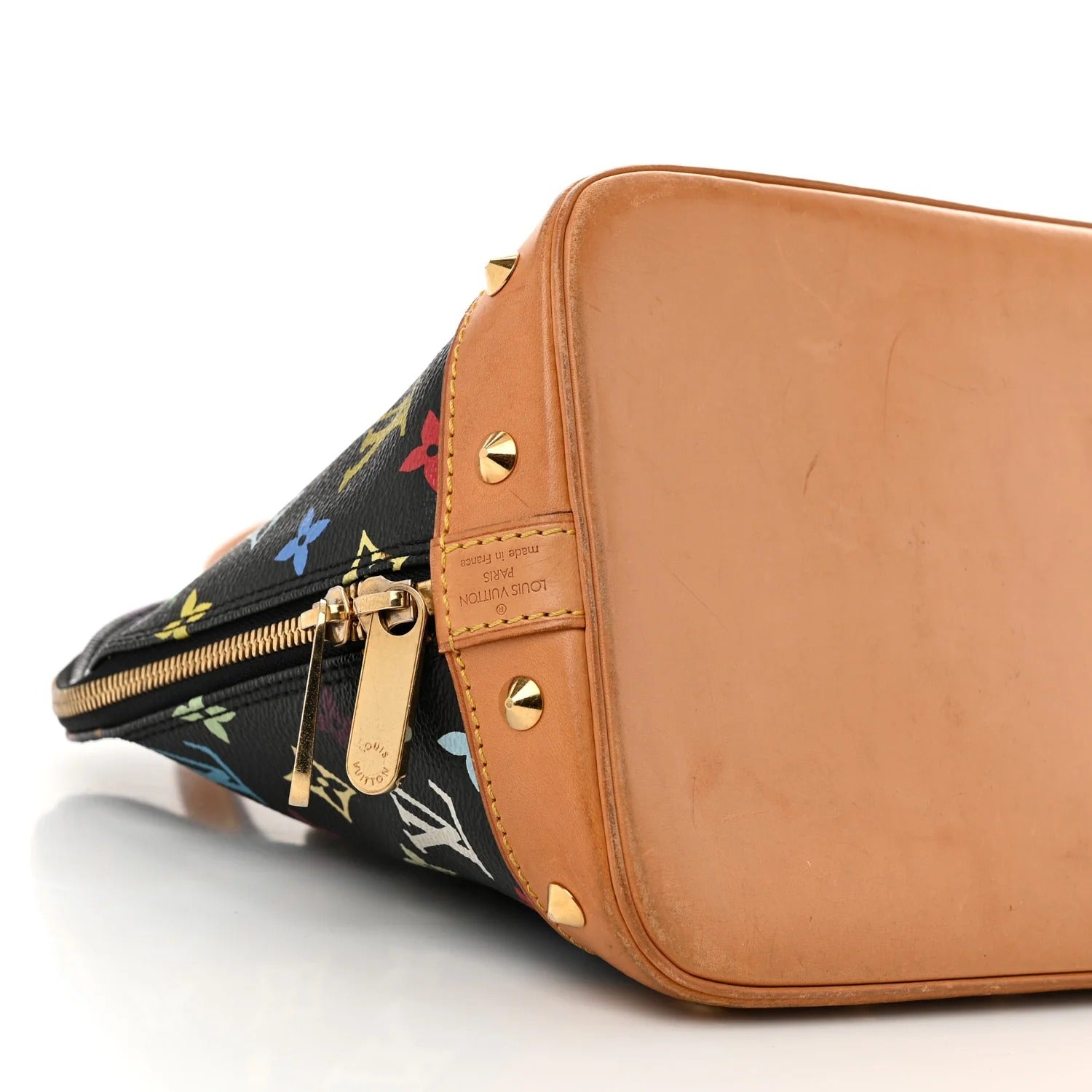 Brown leather handbag with floral patterned interior on a white background