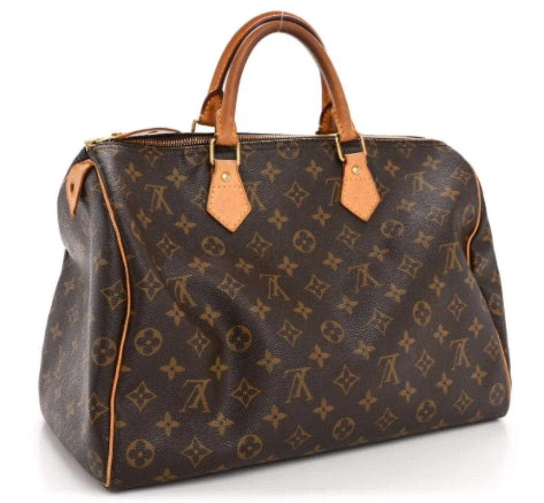 Louis vuitton speedy 35 handbag with monogram pattern on a white background