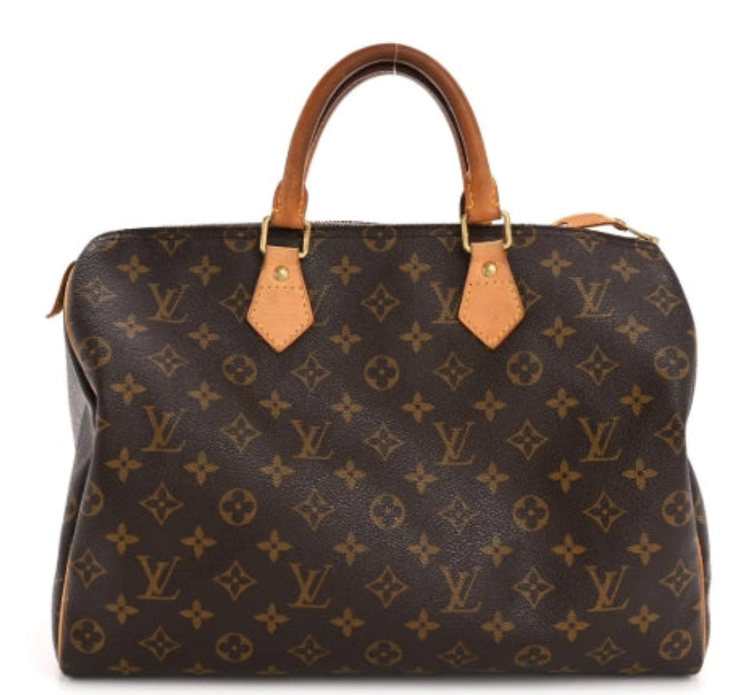 Louis vuitton speedy 35 handbag with monogram pattern on a white background