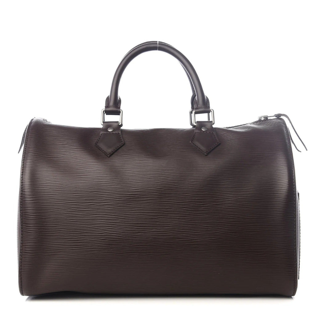 Brown leather handbag with silver hardware on a white background